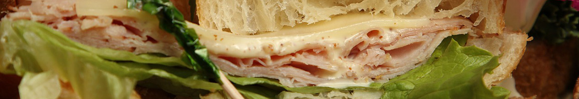 Eating Sandwich Peruvian Bakery at Miski Bakery & Cafe restaurant in Davie, FL.